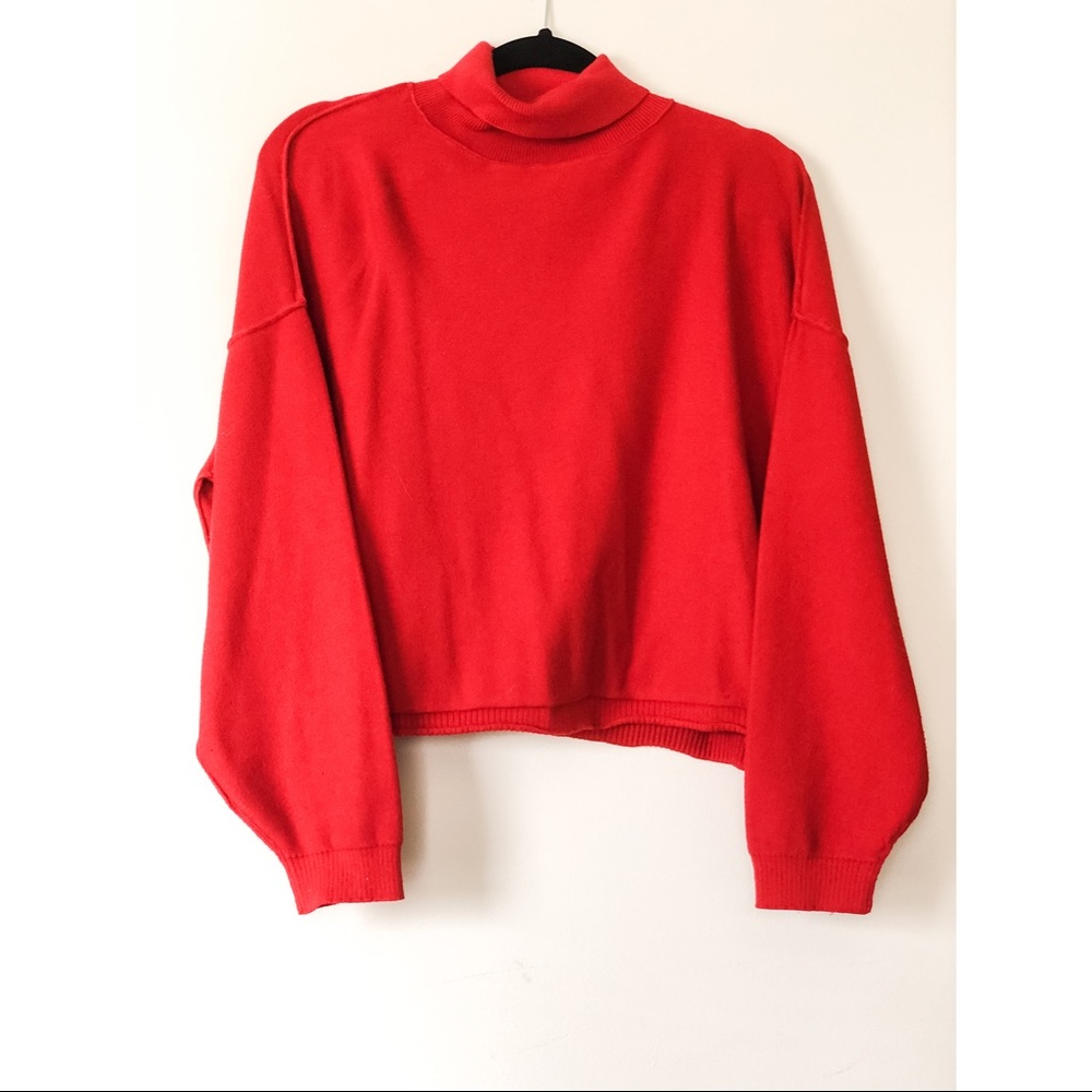 Red long sleeve sweater.